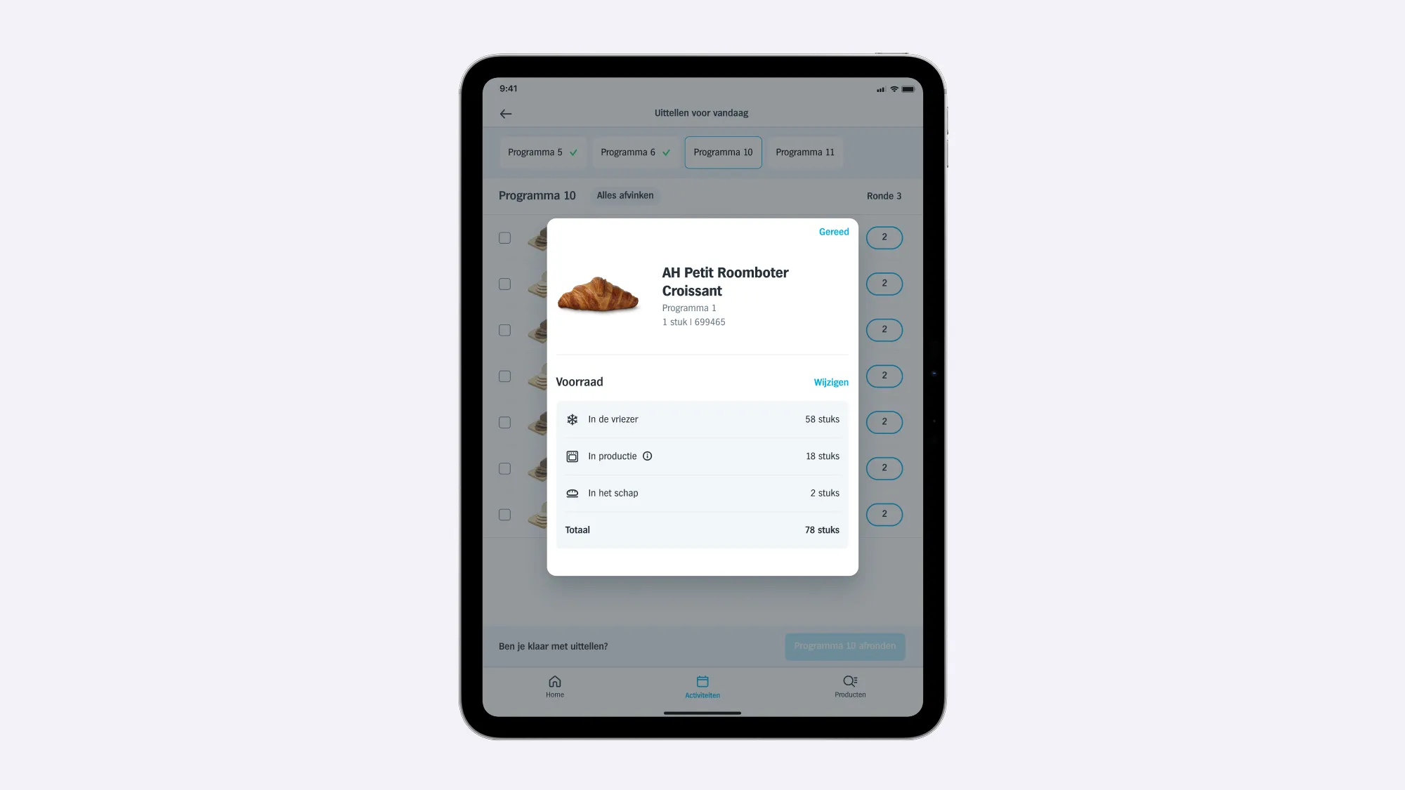 Bak on an iPad with a product's stock in the freezer, in production and on the shelf, opened from the count-out list